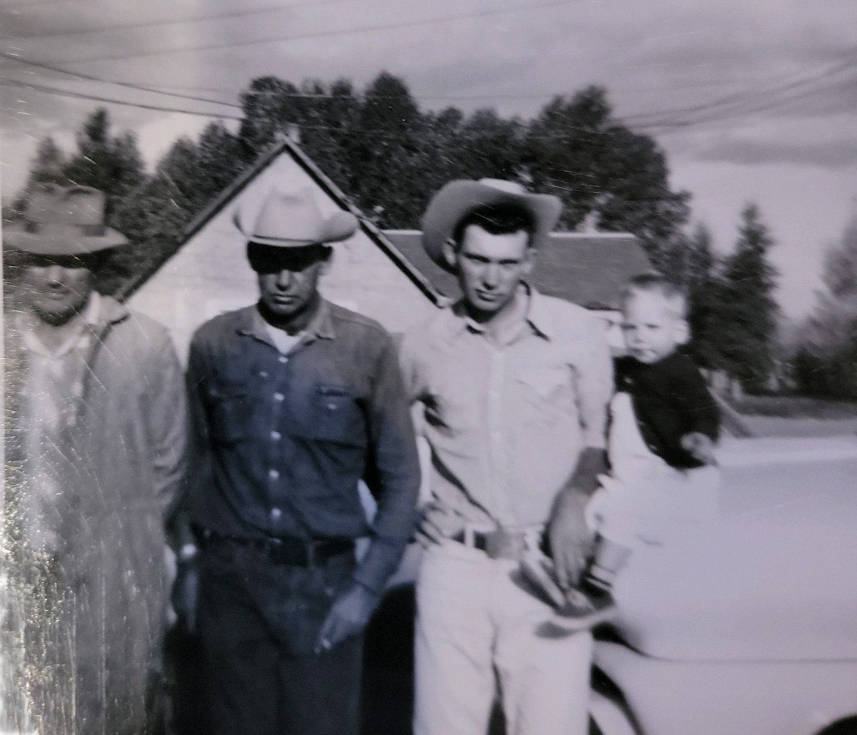 three men and a little boy