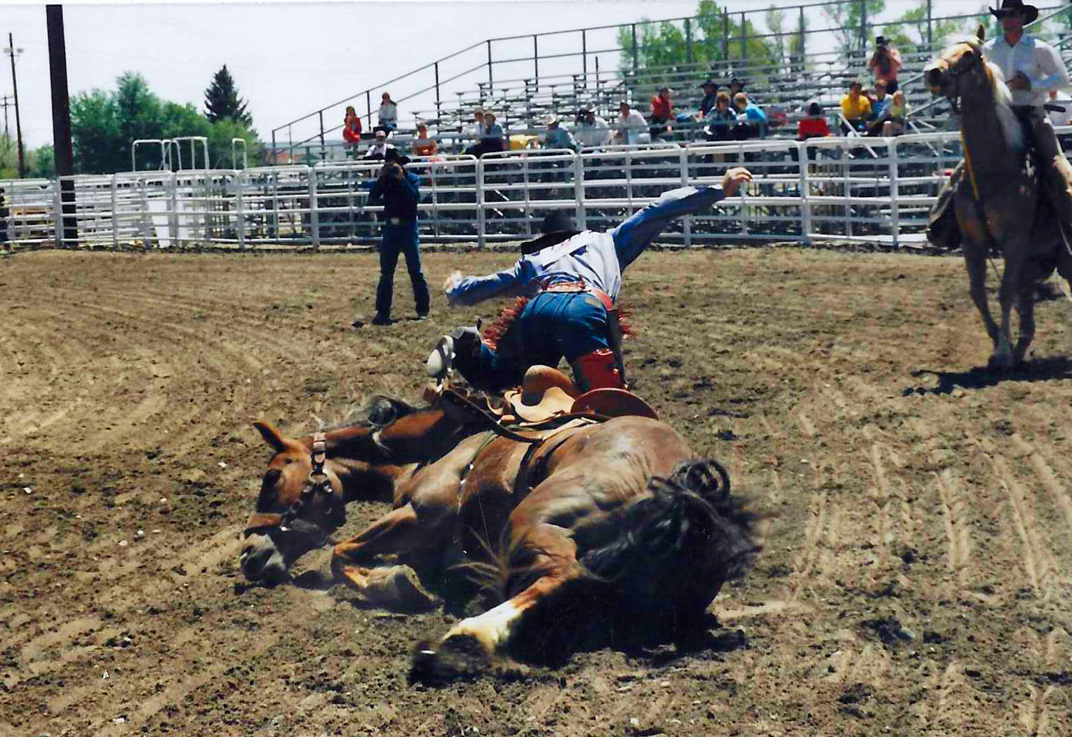 man leaping clear of a saddled horse