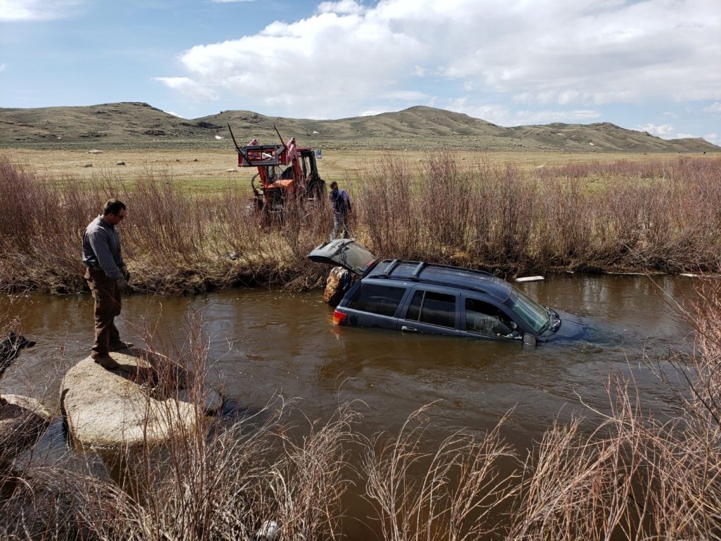 car in pond